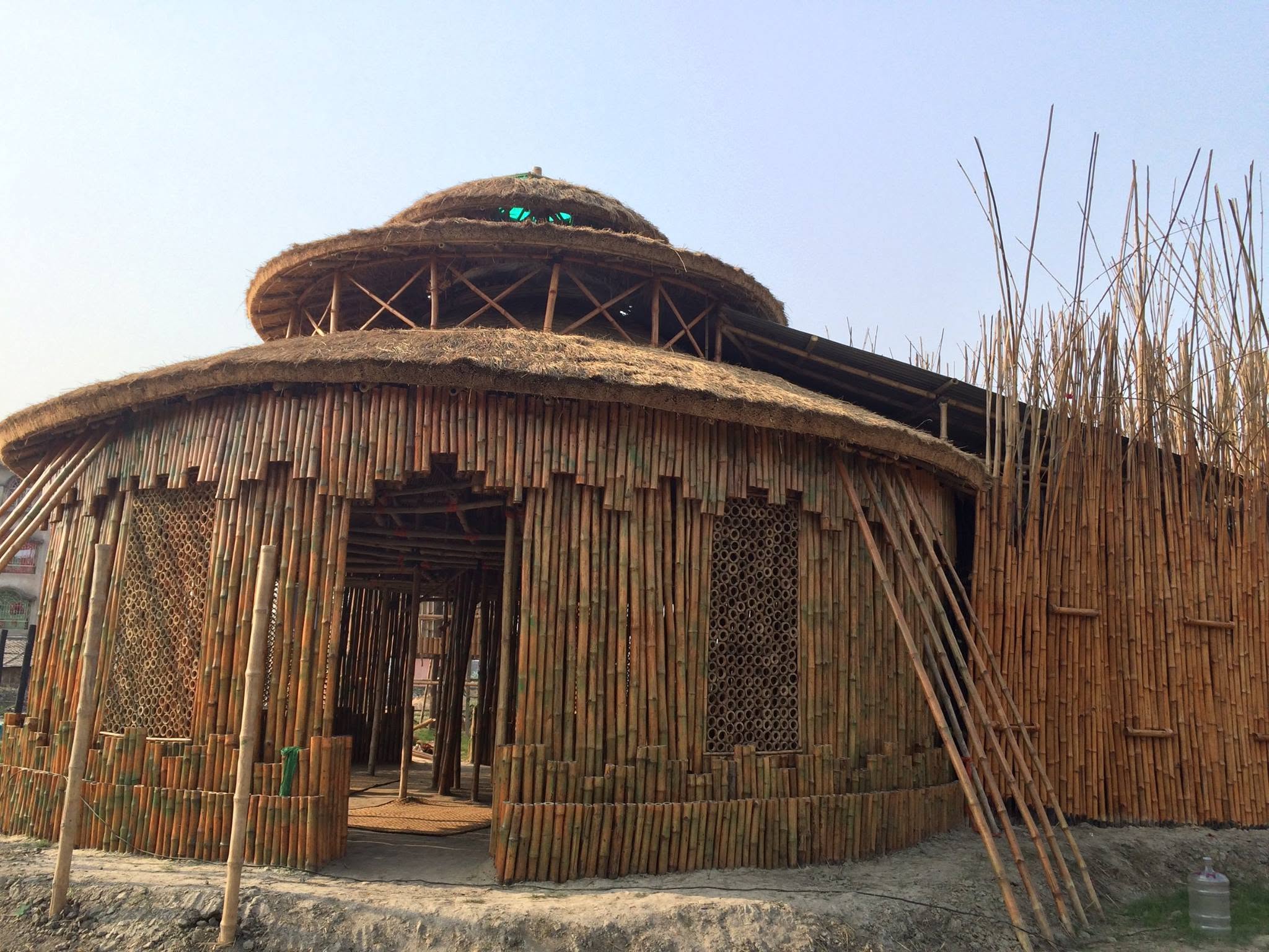 Close view of the bamboo facade and lattice windows of the Harmony Center
